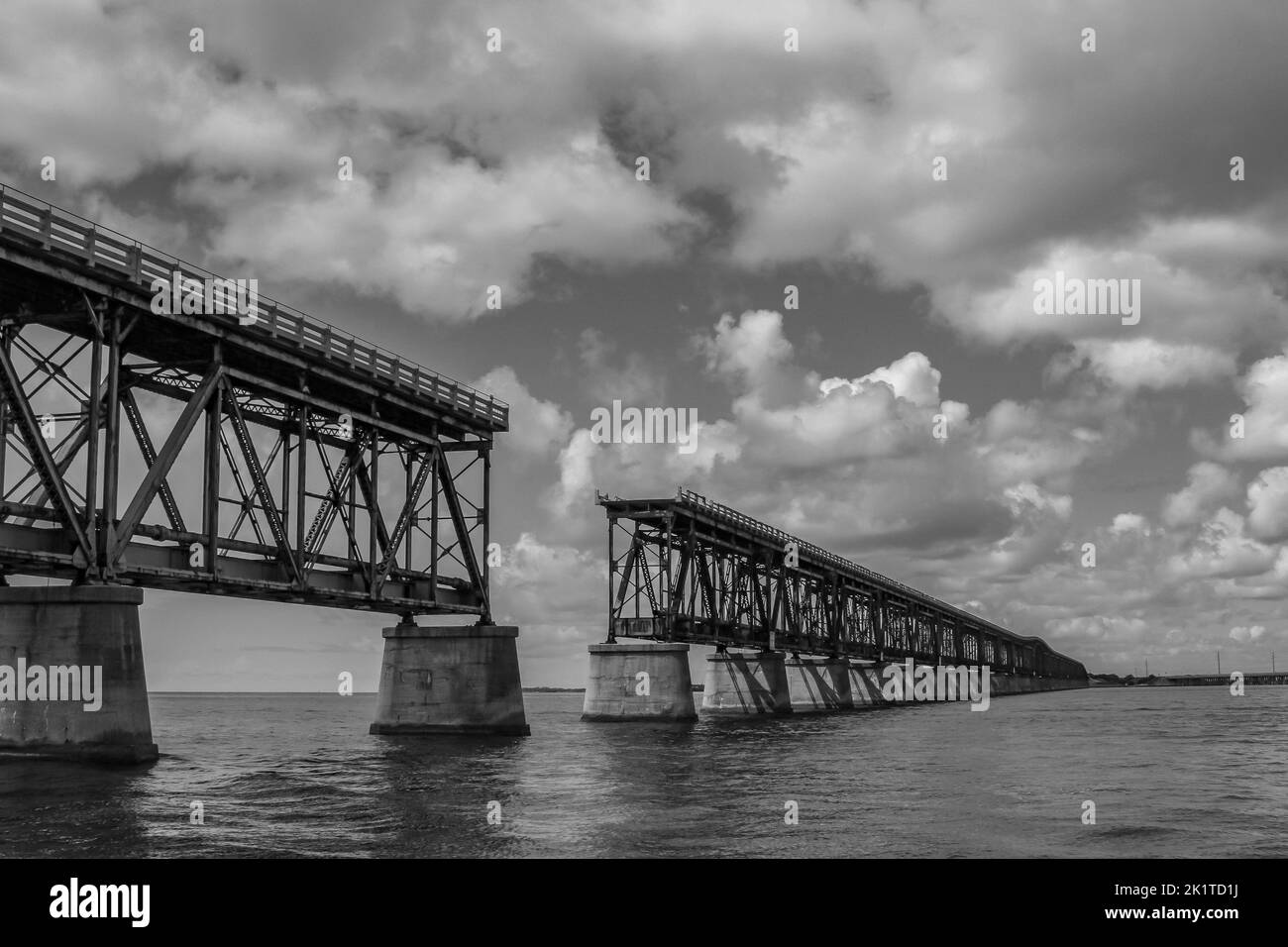 A grayscale of the abandoned Historical Railroad Bridge In Bahia Honda Key Stock Photo