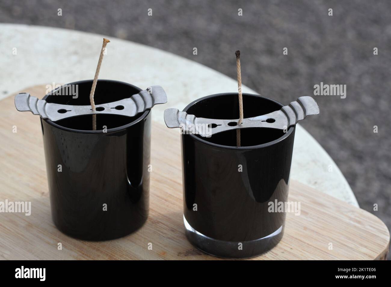Candle making. Two glass candles containers wicked and ready for the