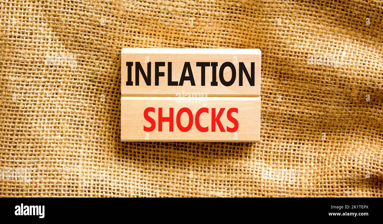 Inflation shocks symbol. Concept words Inflation shocks on wooden blocks. Beautiful canvas table canvas background. Business inflation shocks concept. Stock Photo