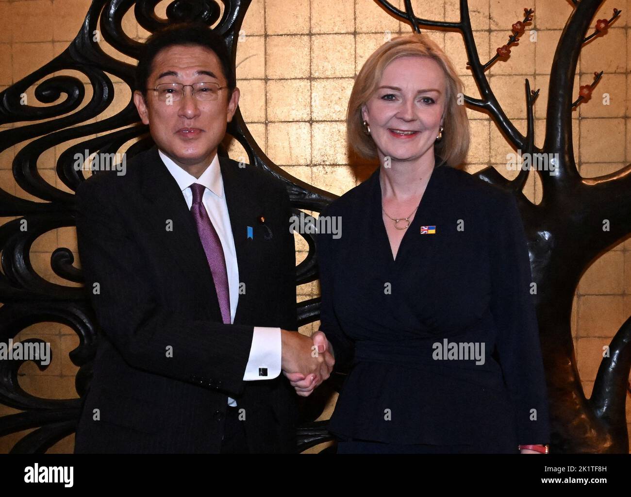Prime Minister Liz Truss shake hands with Prime Minister of Japan, Fumio Kishida, ahead of a lunch bilateral meeting at a Japanese restaurant during her visit to the US to attend the 77th UN General Assembly. Picture date: Tuesday September 20, 2022. Stock Photo