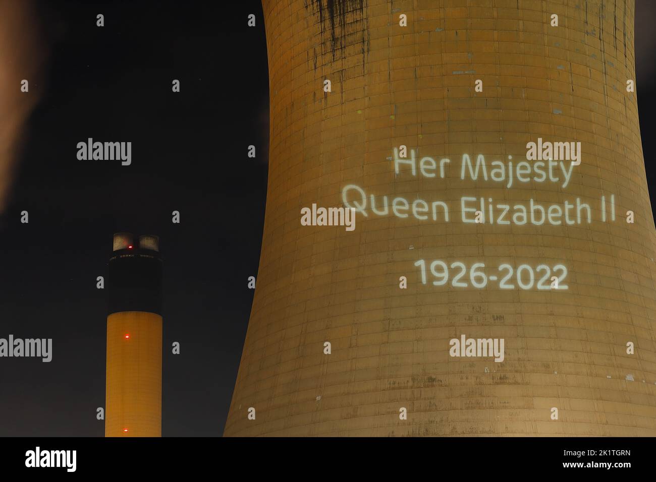 An outline of HRH Queen Elizabeth's head was projected onto one of the cooling towers of Drax Power Station to pay tribute after her death. Stock Photo