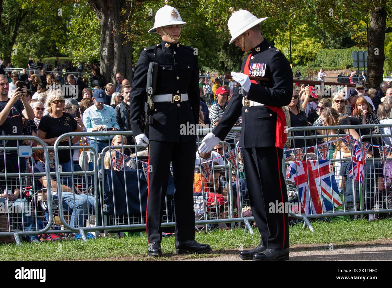 Windsor, UK. 19th September, 2022. A Royal Marine is inspected by an officer on the Long Walk in Windsor Great Park prior to the procession of Queen Elizabeth II's coffin in the State Hearse to St George’s Chapel for the Committal Service. Queen Elizabeth II, the UK's longest-serving monarch, died at Balmoral aged 96 on 8th September 2022 after a reign lasting 70 years. Credit: Mark Kerrison/Alamy Live News Stock Photo