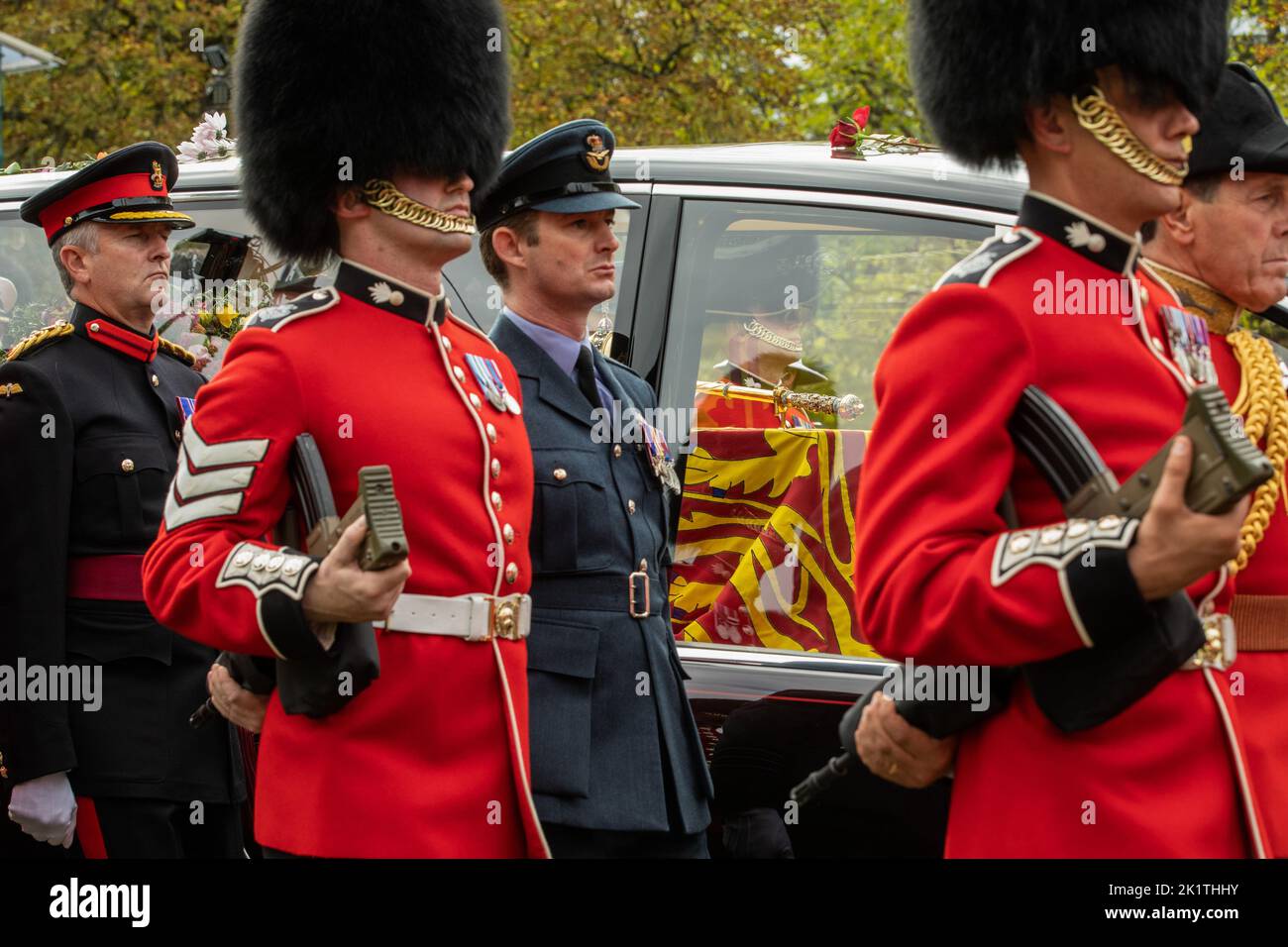 Windsor, UK. 19th September, 2022. Grenadier Guards and other military personnel escort Queen Elizabeth II's coffin lying in the State Hearse on the Long Walk in Windsor Great Park during a procession from Shaw Farm Gate to St George’s Chapel for the Committal Service. Queen Elizabeth II, the UK's longest-serving monarch, died at Balmoral aged 96 on 8th September 2022 after a reign lasting 70 years. Credit: Mark Kerrison/Alamy Live News Stock Photo