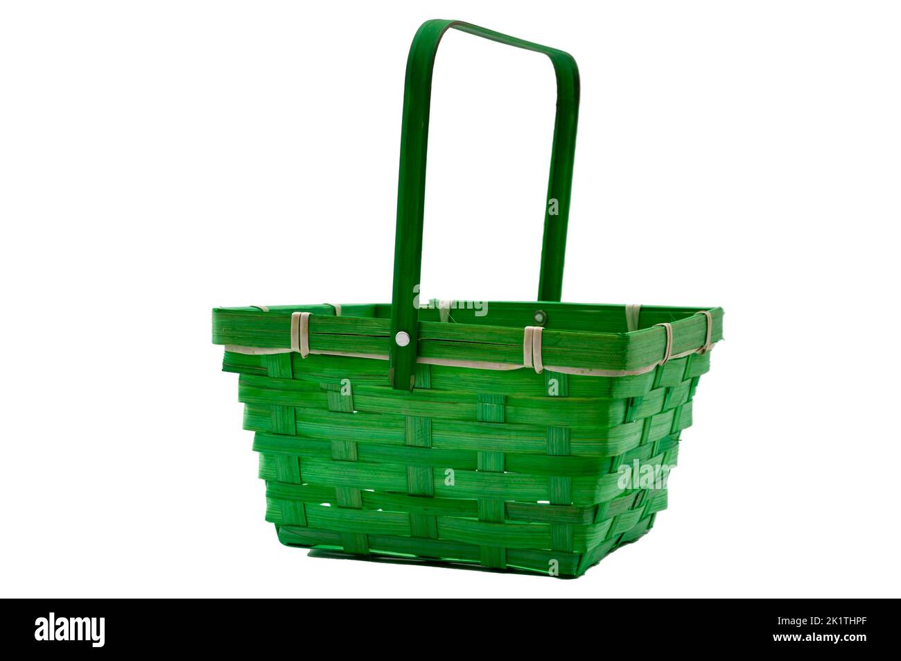 Ornamental empty green wicker basket isolated on white background with clipping path cutout concept for independent supermarket, buy from a local farm Stock Photo