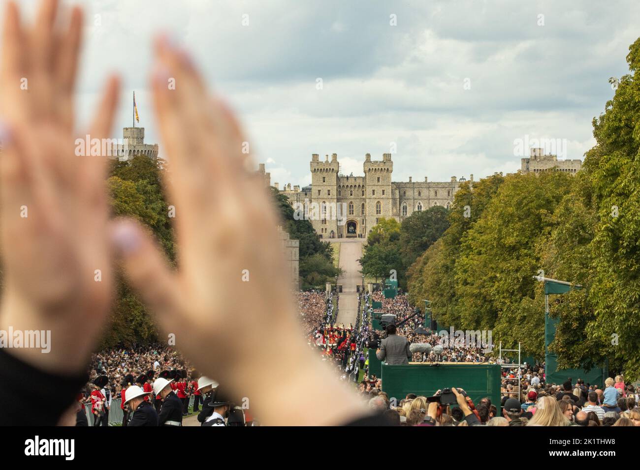Windsor, UK. 19th September, 2022. A member of the public applauds during the procession of Queen Elizabeth II's coffin in the State Hearse along the Long Walk to St George’s Chapel for the Committal Service. Queen Elizabeth II, the UK's longest-serving monarch, died at Balmoral aged 96 on 8th September 2022 after a reign lasting 70 years. Credit: Mark Kerrison/Alamy Live News Stock Photo