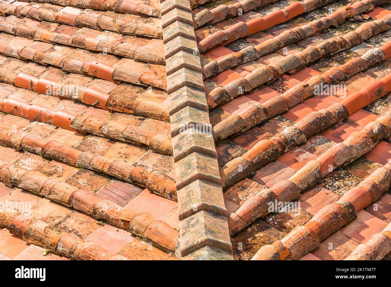 Ceramic orange clay tiles on the roof of a building, corner Stock Photo