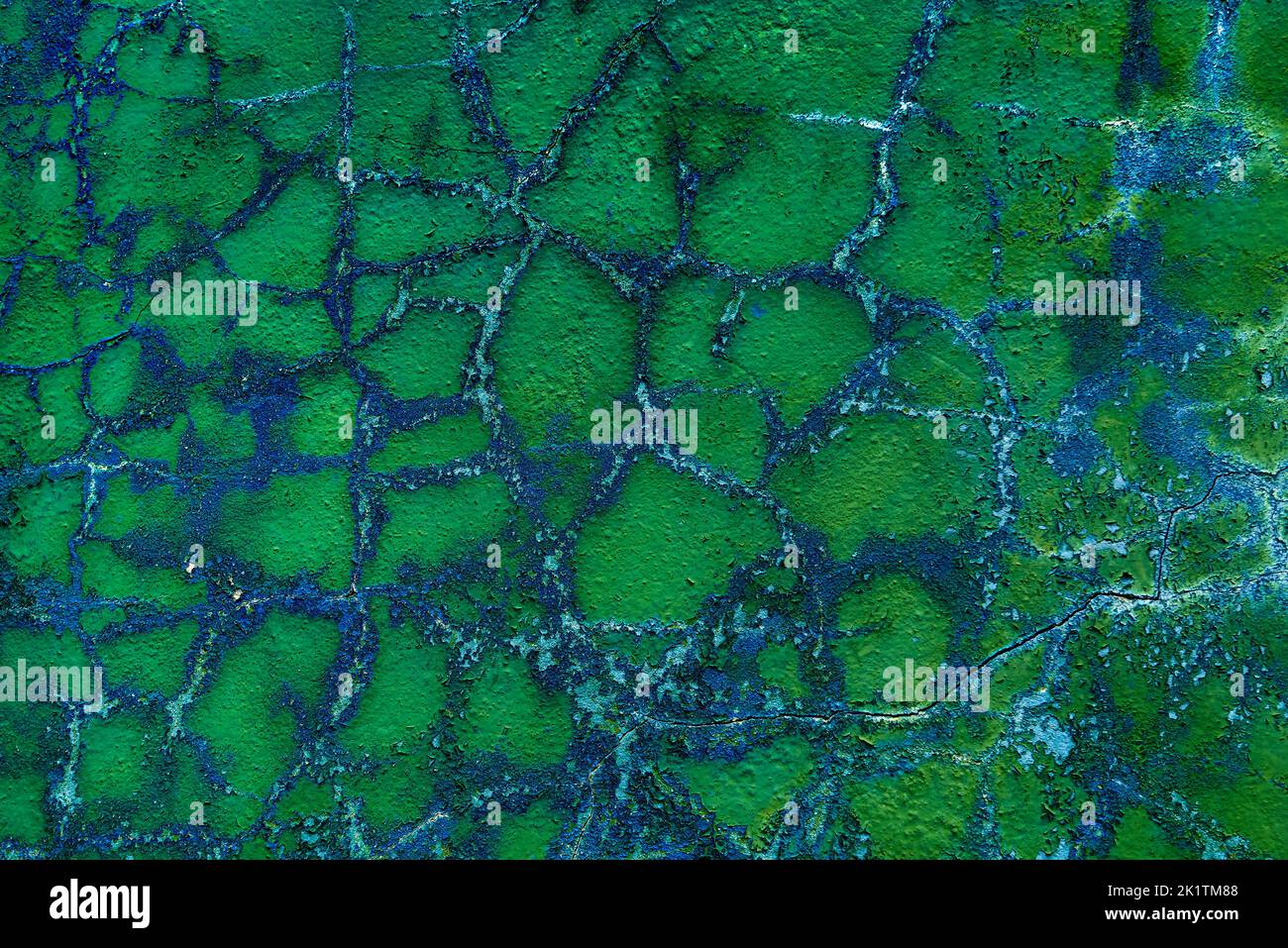 turquoise painted stucco with cracks and peeling paint flakes Stock