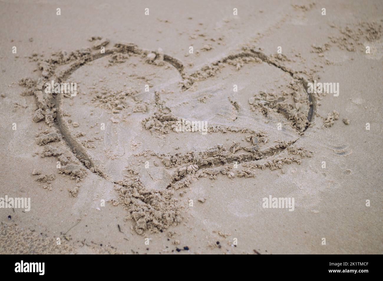 Love sign in Sand Sea Beach Stock Photo