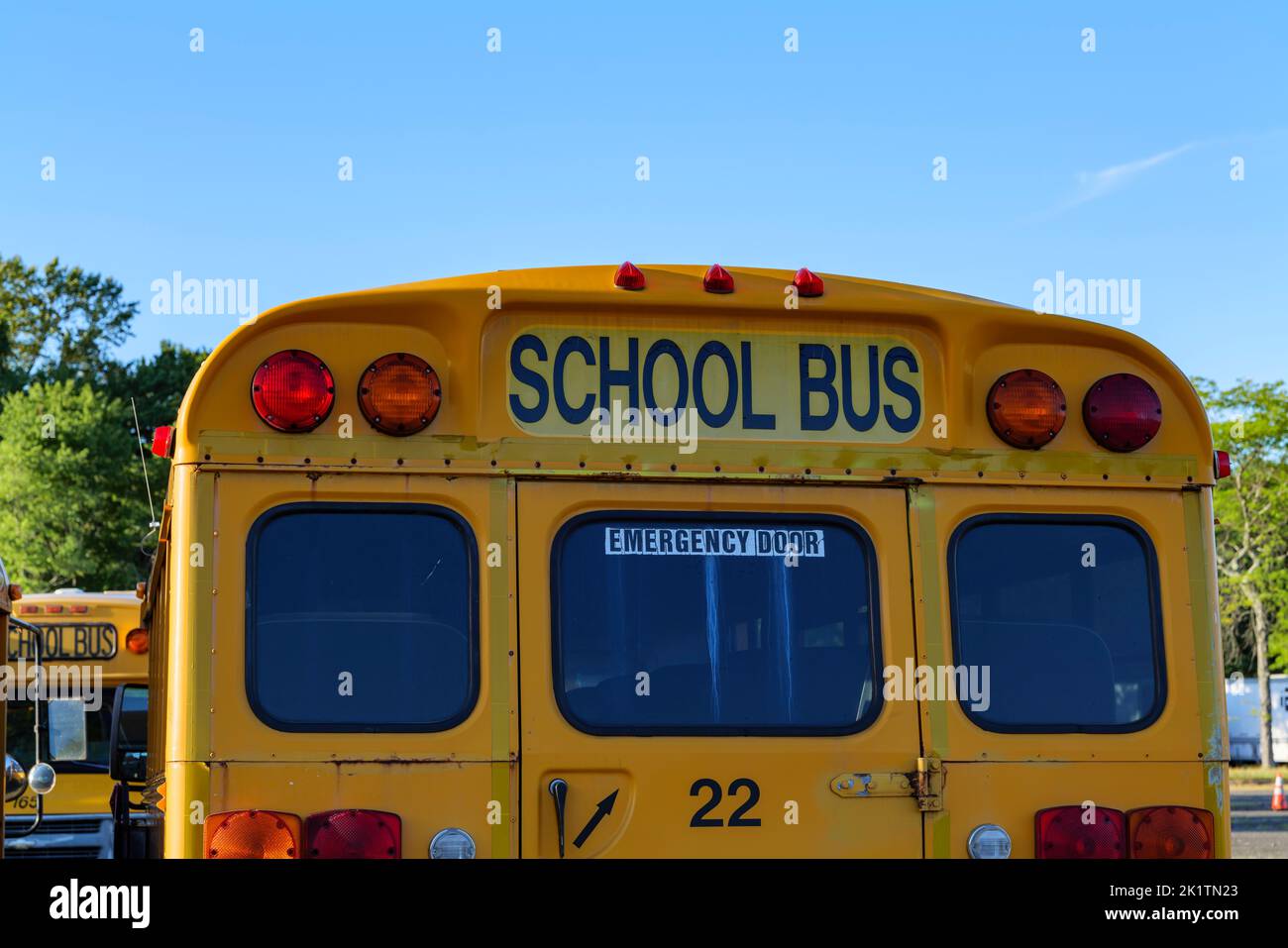 Top of a yellow school bus with lights and text. Back to school concept ...