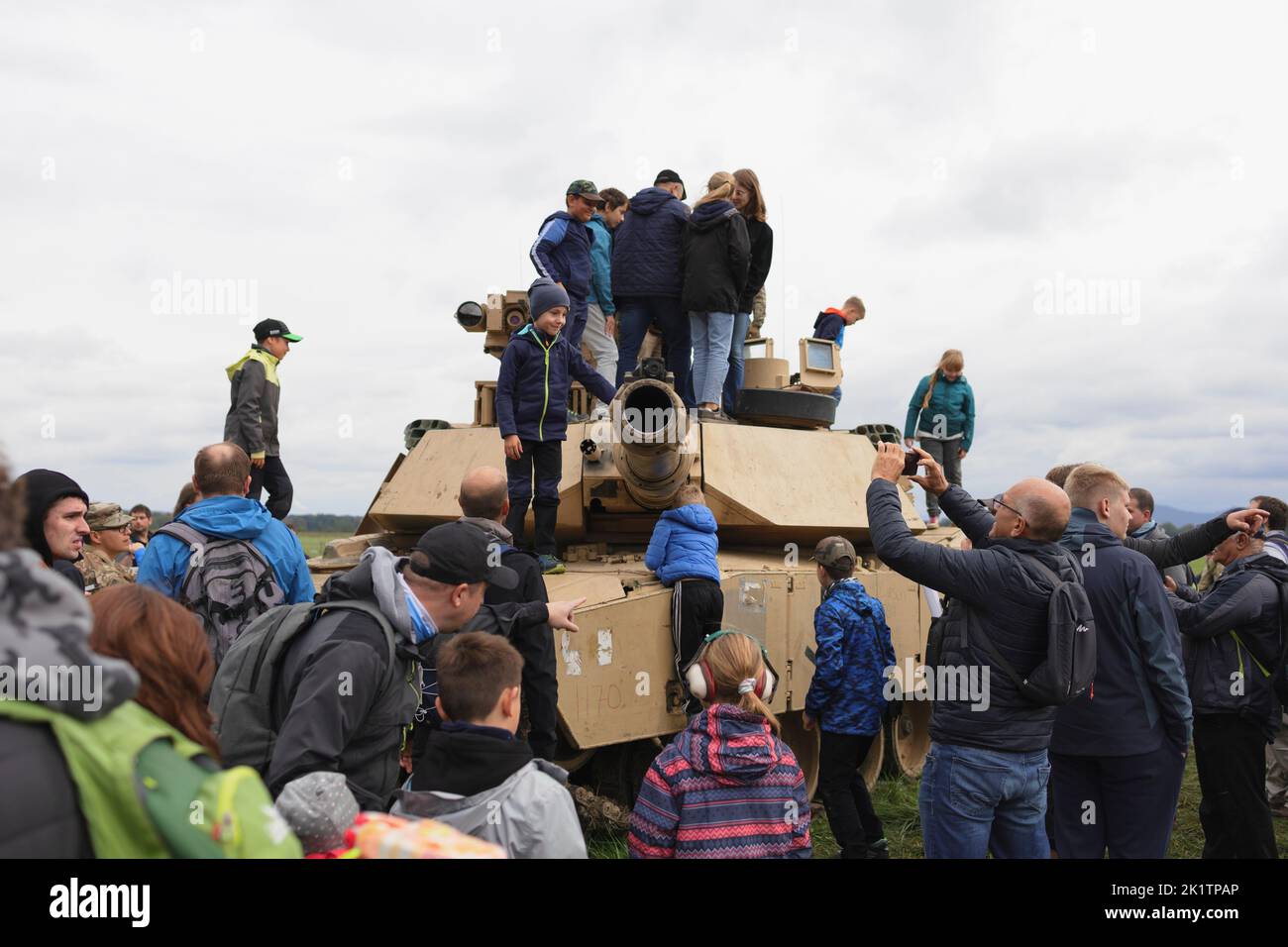 Mosnov, Czech Republic, Czechia - September 17, 2022: Children, kids and civilian people on military show and display. Crowd on the tank from US army. Stock Photo