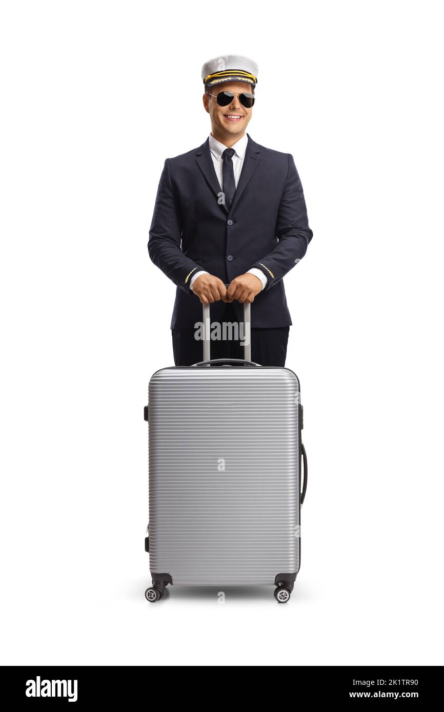 Young pilot standing with a suitcase isolated on white background Stock Photo