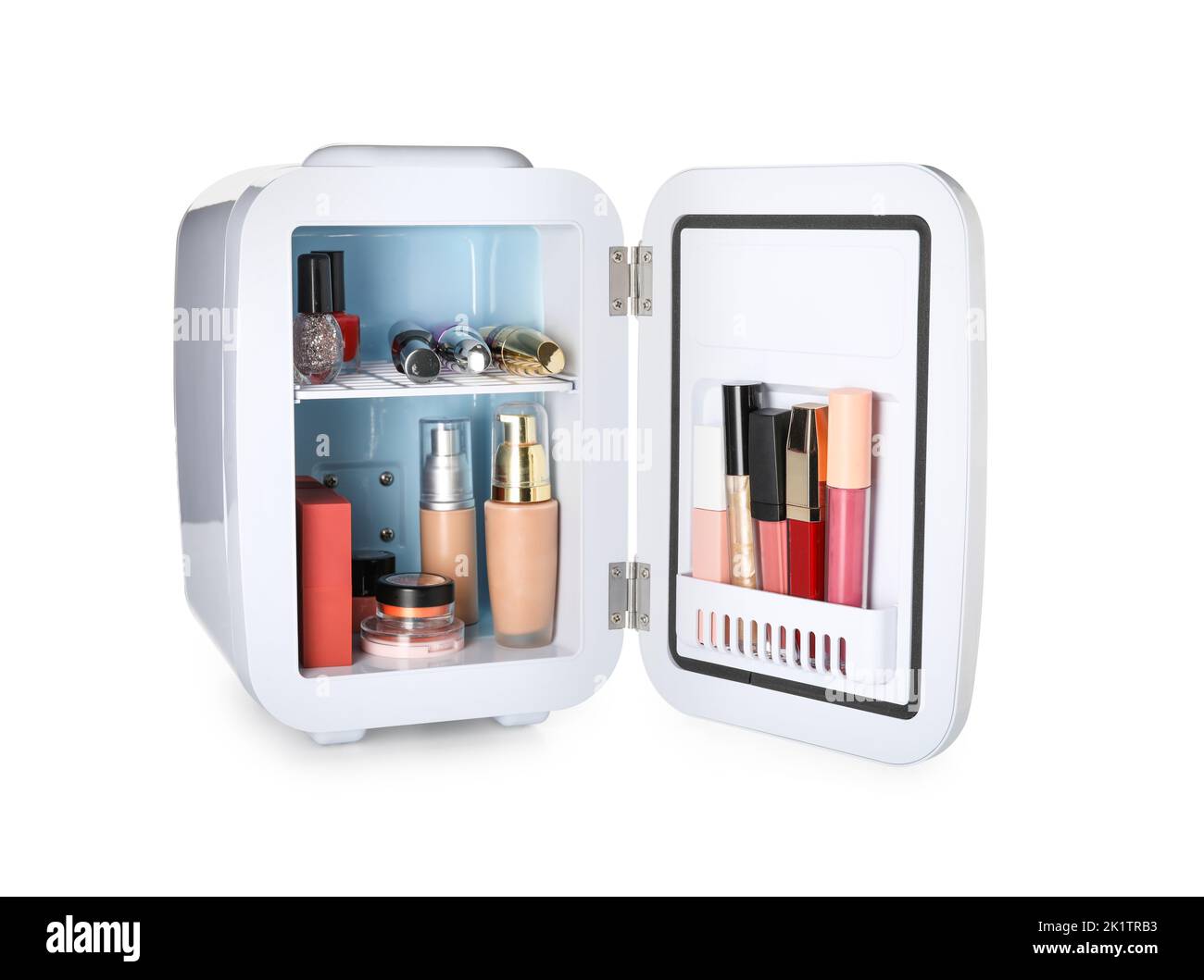 Small cosmetic refrigerator with makeup products on white background Stock Photo Alamy