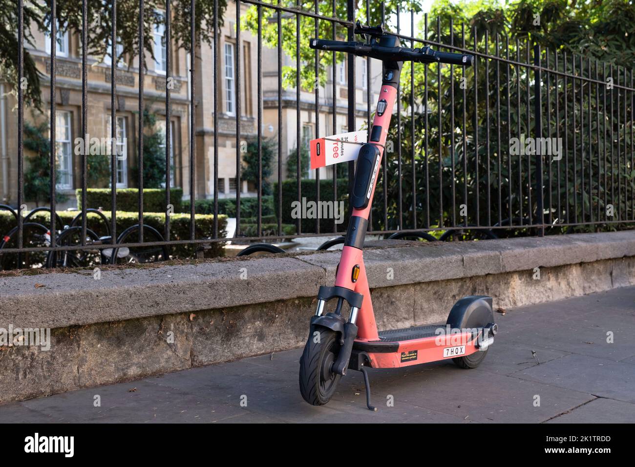 Shared E-scooters or e-steps of the company VOI for rent in a street in Oxford, England. E-mobility Stock Photo