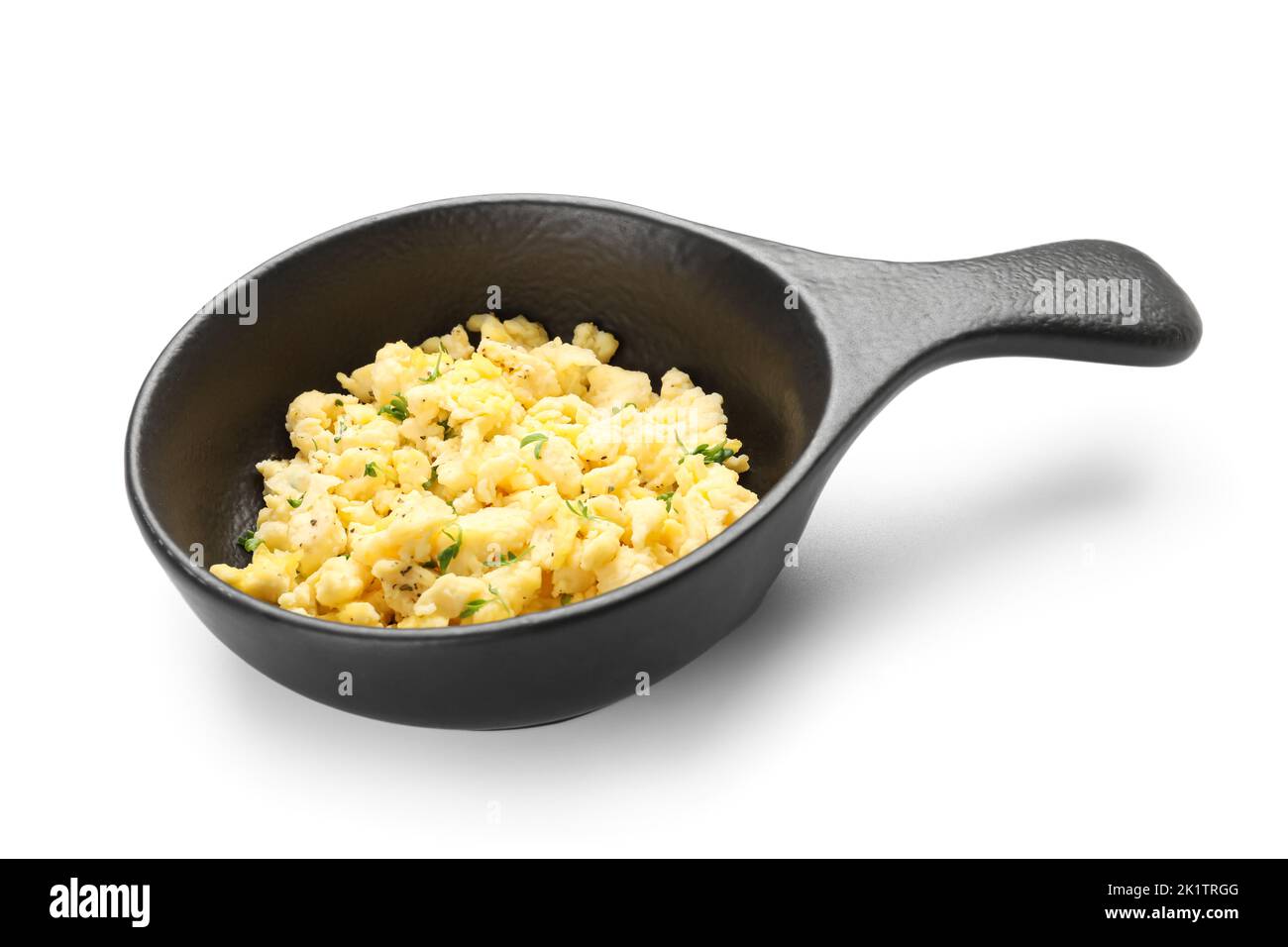 Frying pan with tasty scrambled eggs on white background Stock Photo ...