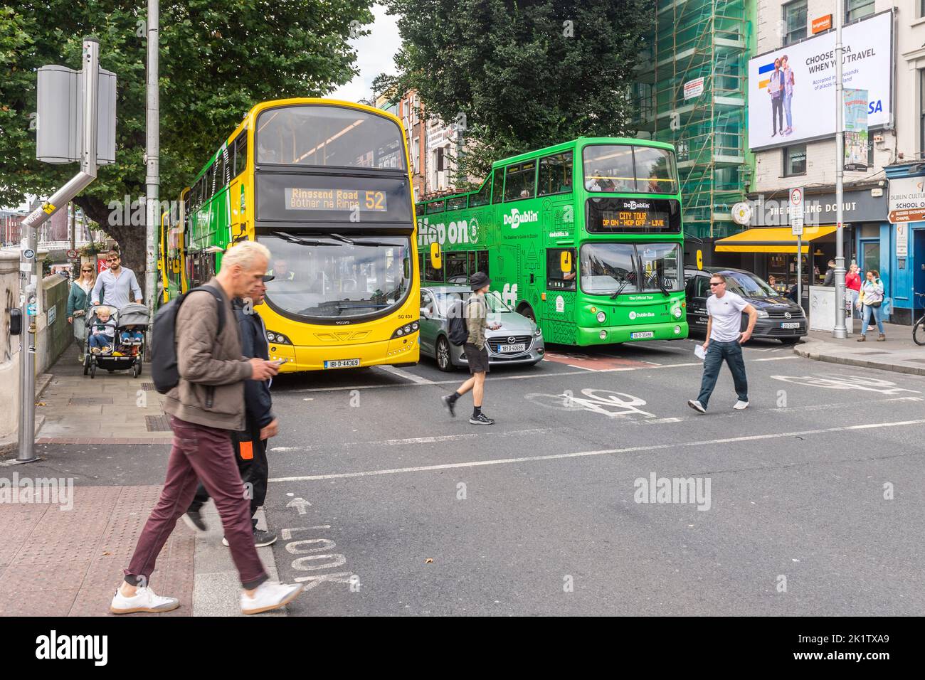 Buses at traffic lights in Dublin City Centre, Ireland. Stock Photo