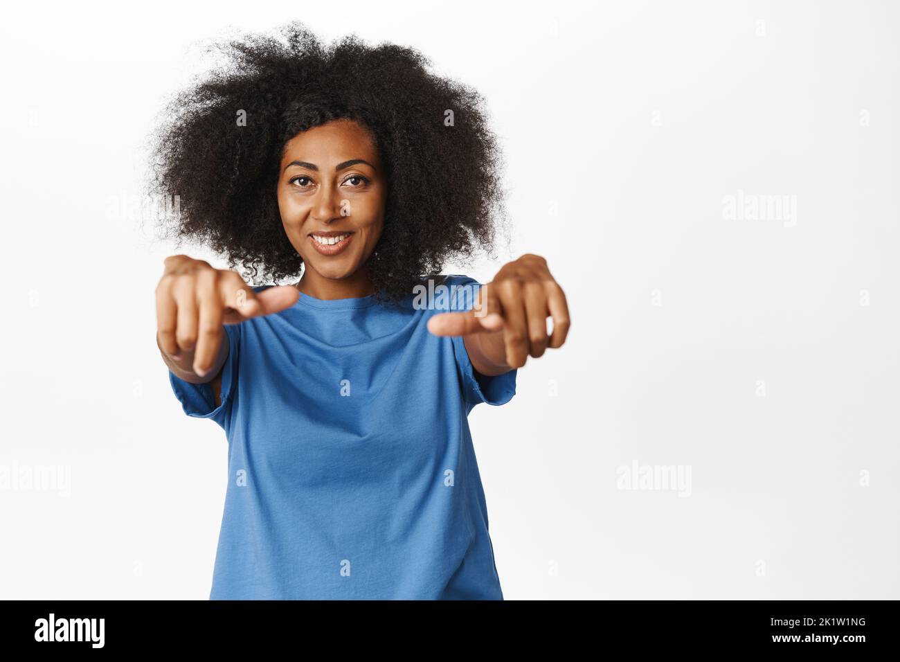 Congrats. Smiling african american modern woman pointing fingers at ...