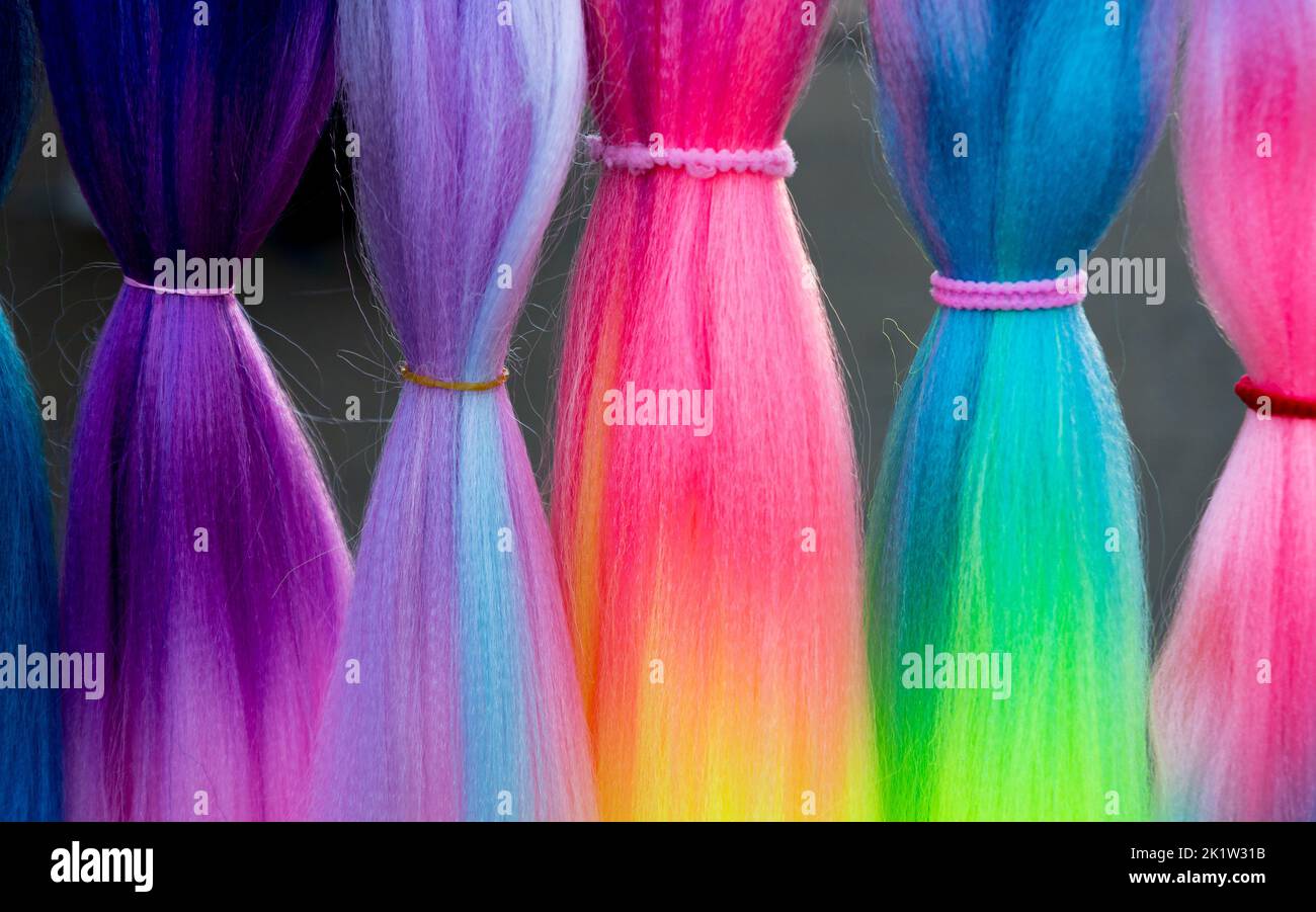 Colored synthetic hair. Strands of colorful artificial hair to attach
