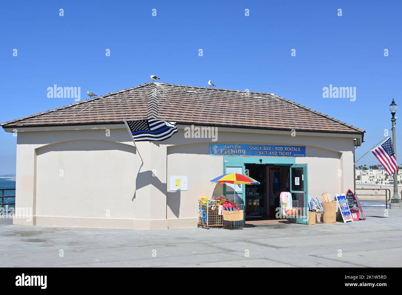HUNTINGTON BEACH, CALIFORNIA, 19 SEPT 2022: Lets go Fishing, bait and tackle, gift shop snack bar combo on the Pier. Stock Photo