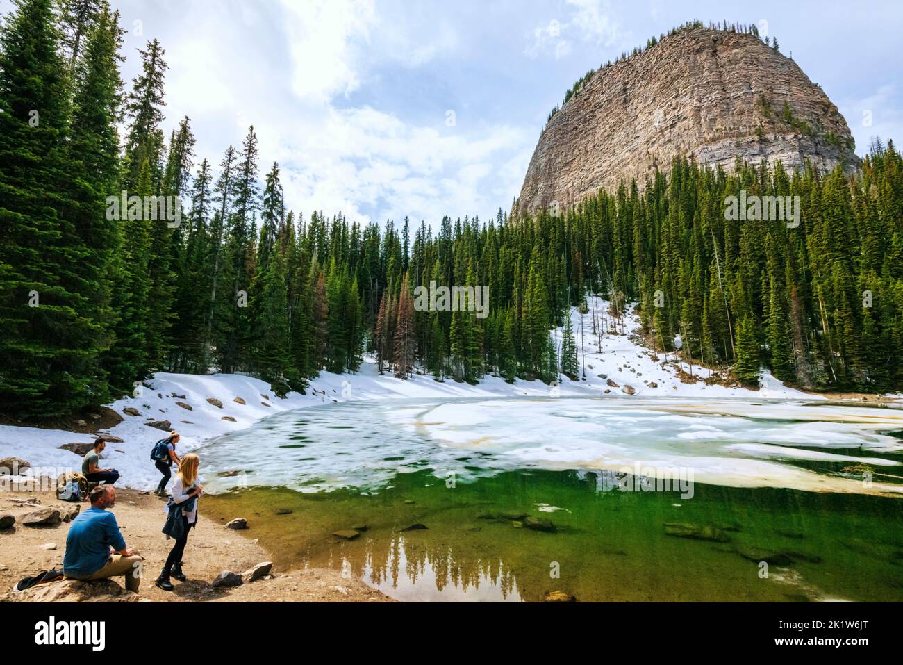Hikers; Mirror Lake at base of The Beehive; Lake Louise; Banff National