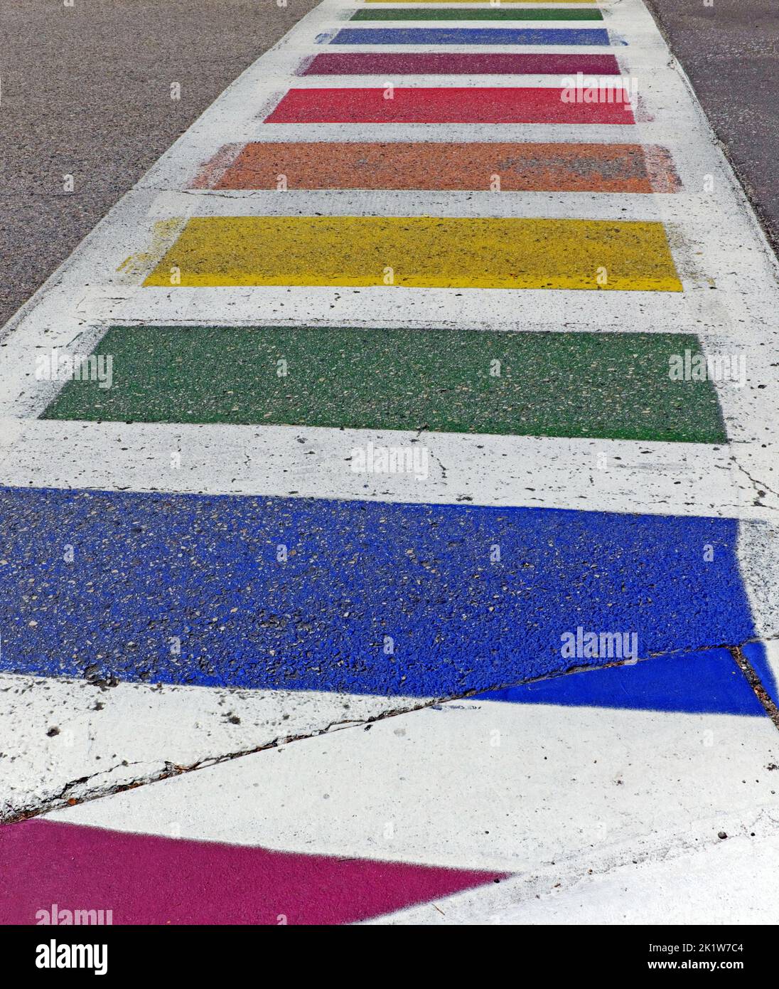 A rainbow painted crosswalk in the LGBTQ friendly midwest town of Douglas, Michigan, USA. Stock Photo
