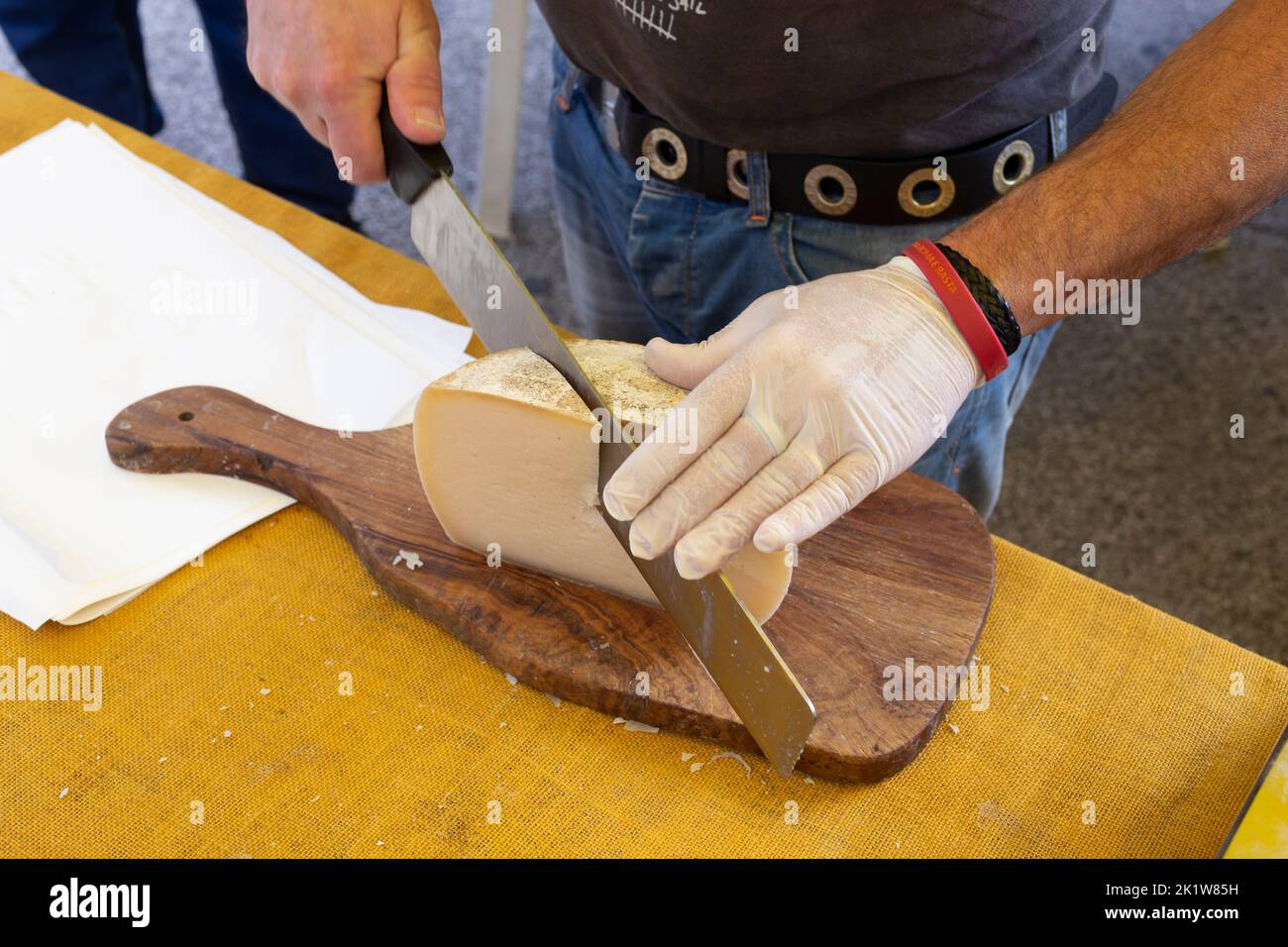 Cutting cheeser in a market Stock Photo