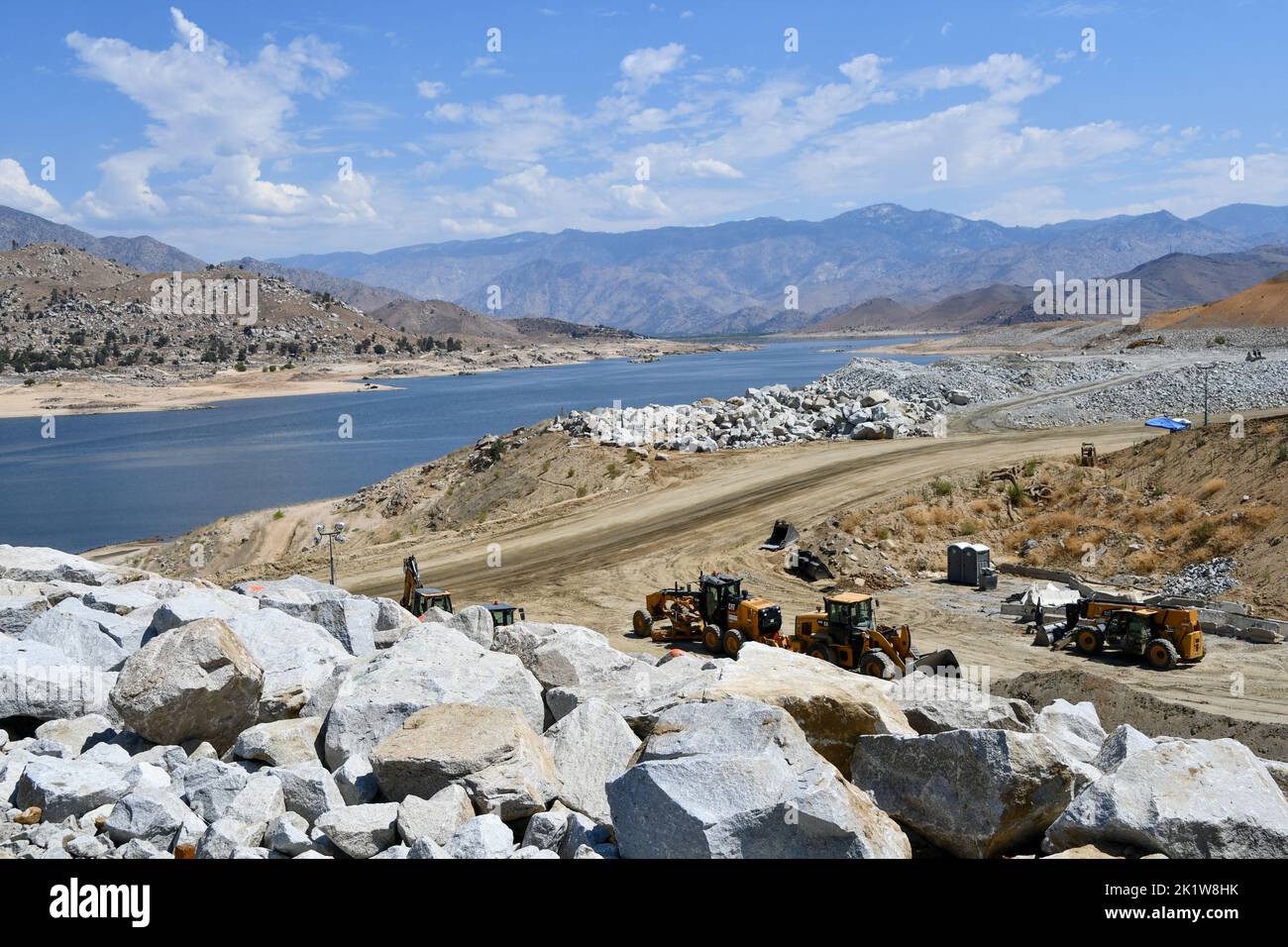 Heavy equipment sits below the main dam at the Isabella Dam Safety