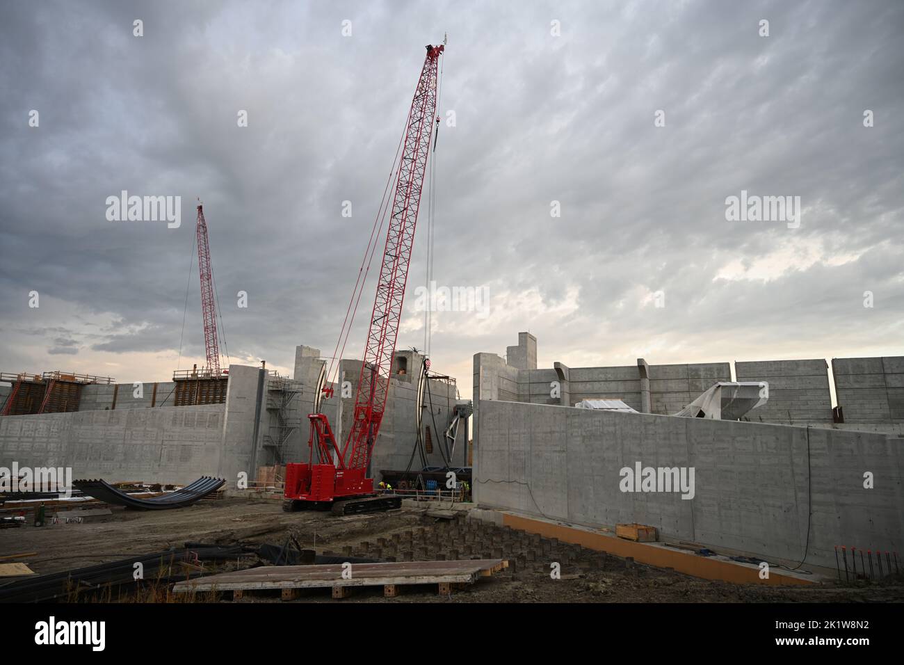A crane lifts a Tainter gate into place at the U.S. Army Corps of