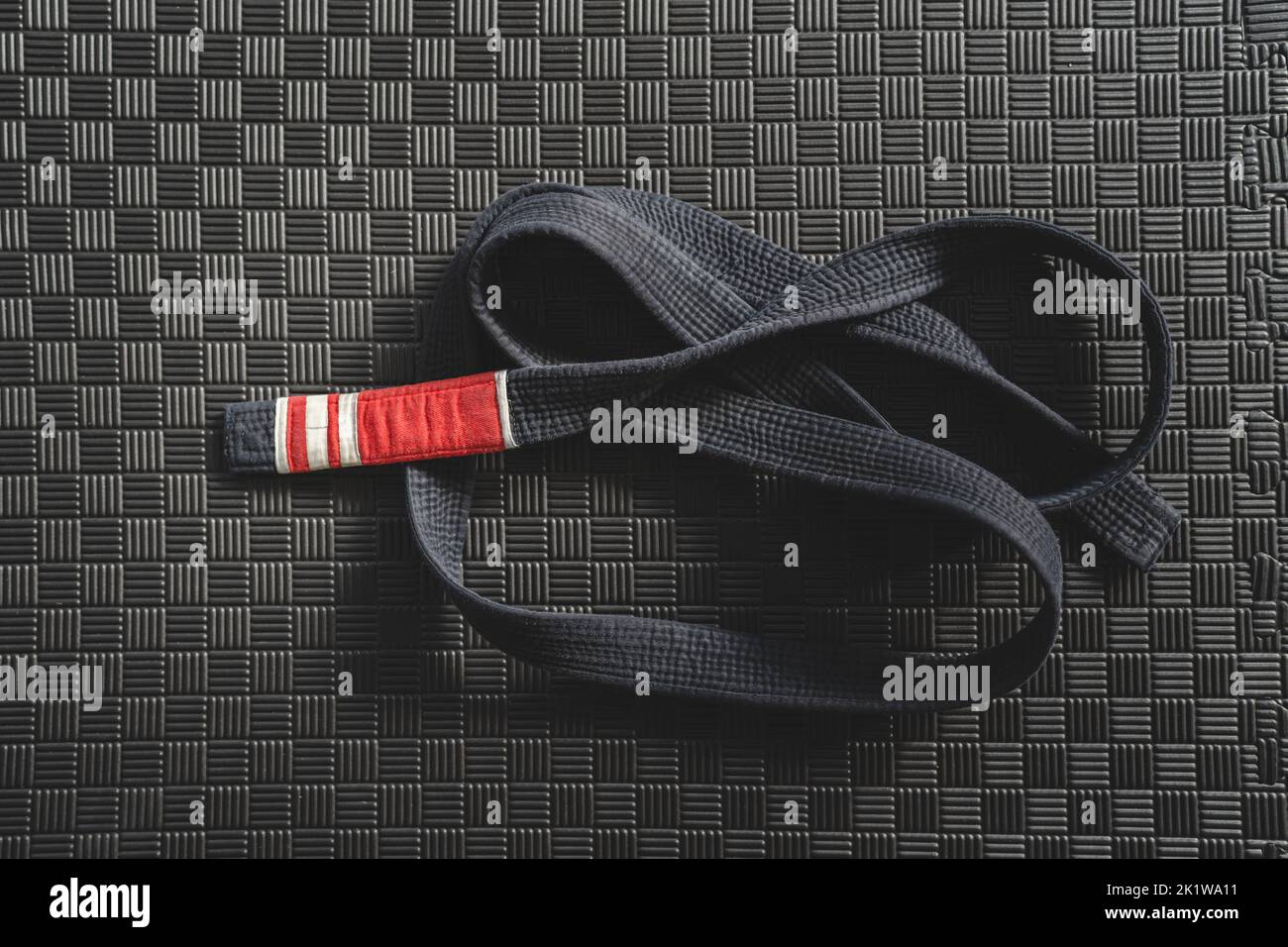 Brazilian jiu jitsu bjj black belt second degree on the tatami mats at gym or academy martial arts concept copy space Stock Photo
