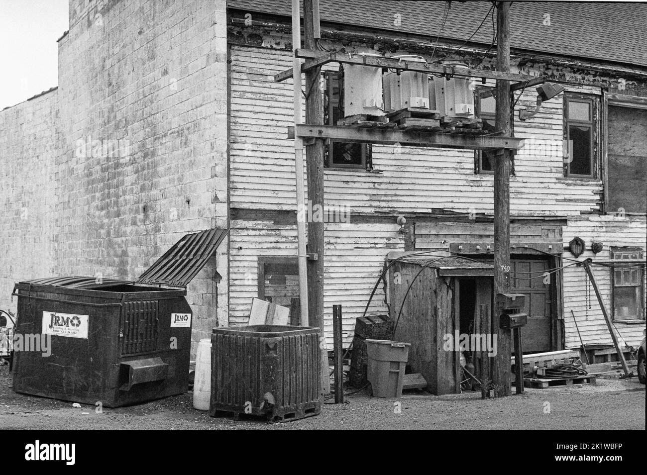 An abandoned factory with a large power plant in Gloucester Harbor