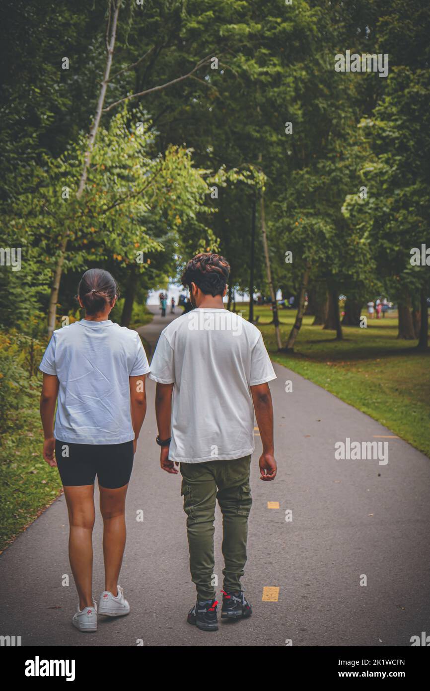 Couples walking in park hi-res stock photography and images - Alamy