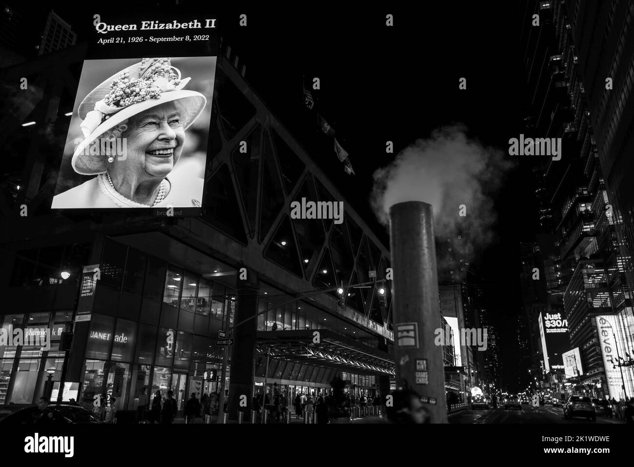 A magnificent memorial displayed on Time Square's jumbotrons to inform New York City of Queen Elizabeth II's passing. Stock Photo