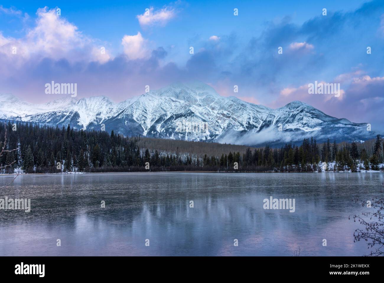 Reflections in Pyramid Lake in winter, Jasper National Park, Alberta, Canada. Stock Photo
