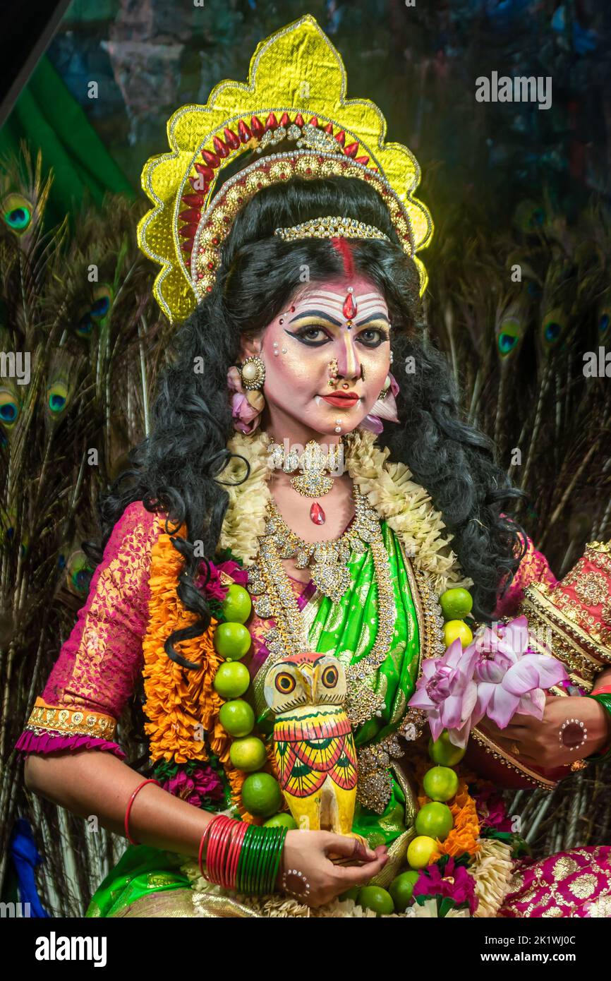 Concept Agomoni shoot with black haired Indian woman face with