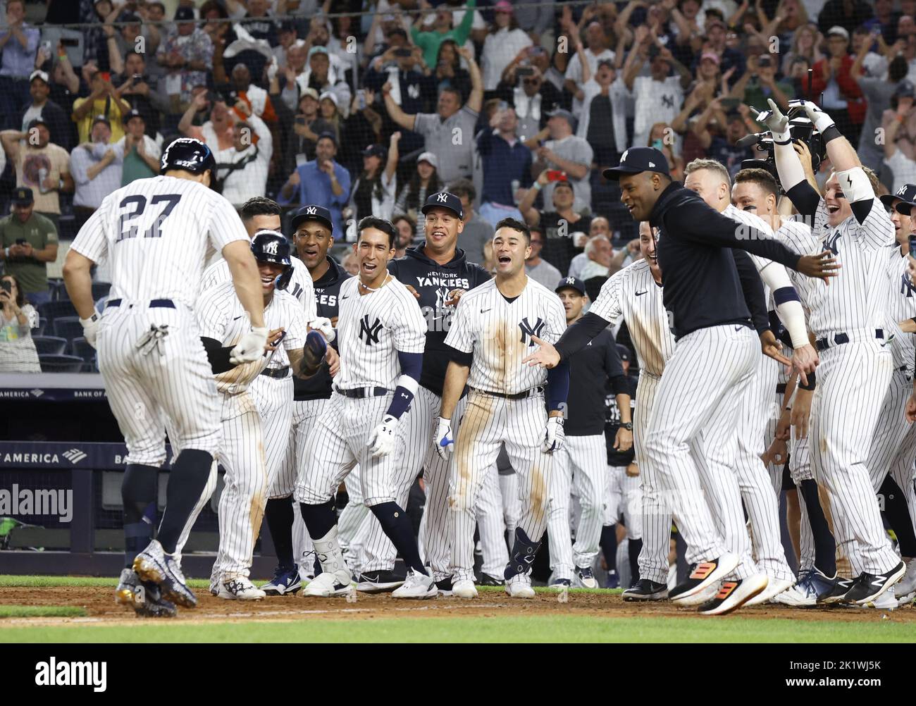 The New York Yankees celebrate after Giancarlo Stanton (27) hit a