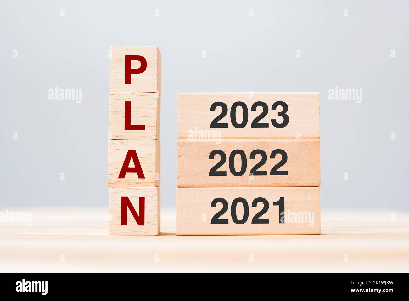 PLAN text with 2023, 2022 and 2021 wooden building blocks on table background. Risk Management, Resolution, strategy, solution, goal, New Year New You Stock Photo
