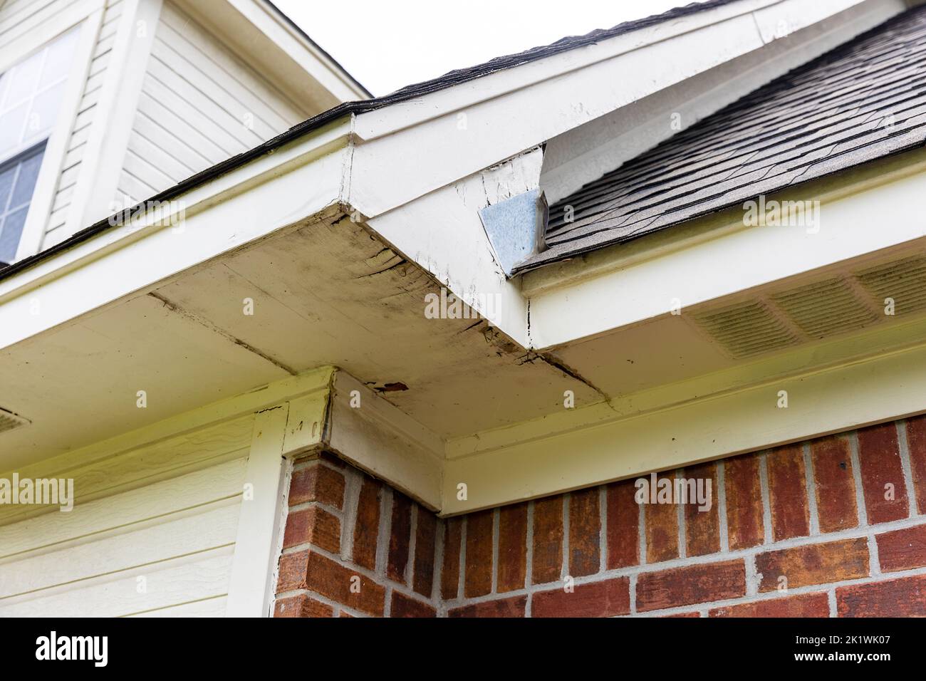 Rotten wood on Soffit and Fascia boards of house Stock Photo