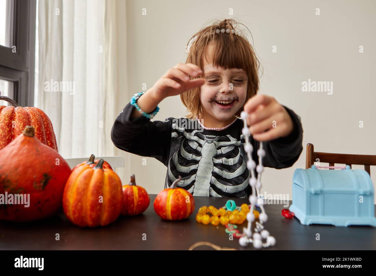 Happy child dressing up with decorations before halloween holiday Stock Photo