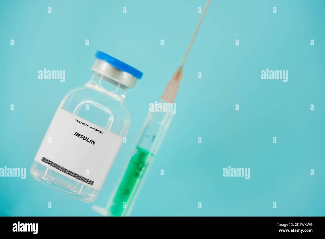Insulin syringe and vial, conceptual image Stock Photo