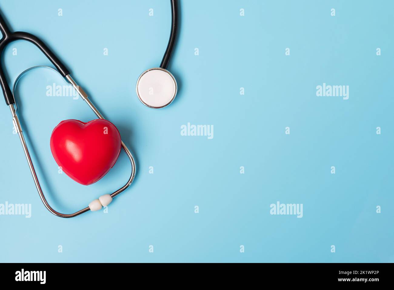 Top view Stethoscope with Red heart shape on blue background with copy ...