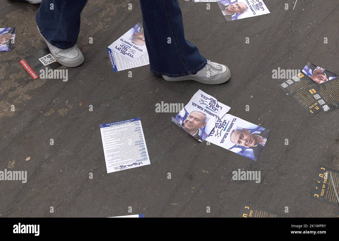 Israeli students walk over party leaflets as they gather for a mock parliamentary election at Bleich school on September 20, 2022 in Ramat Gan, Israel. Bleich High School holds a mock parliamentary election and panel ahead of every election, inviting members of all parties to participate. The high school has earned a reputation for accurately predicting the results of previous Knesset elections. Stock Photo