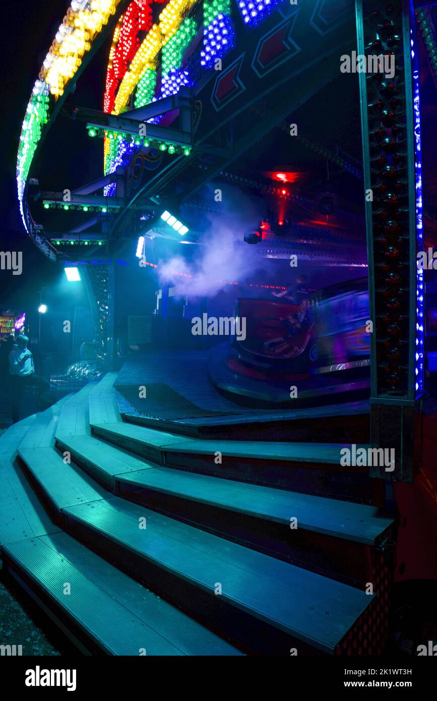 Spinning rides, waltzer at funfair in summer at night Stock Photo - Alamy