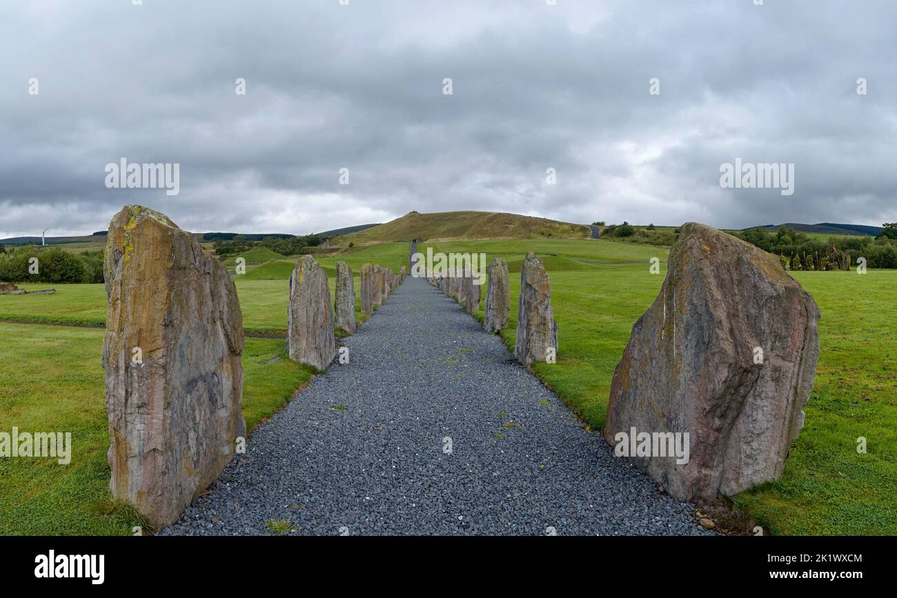 the standing stones and gravel footpath in the North-South Line of the Crawick Multiverse in Dumfries and Galloway Stock Photo