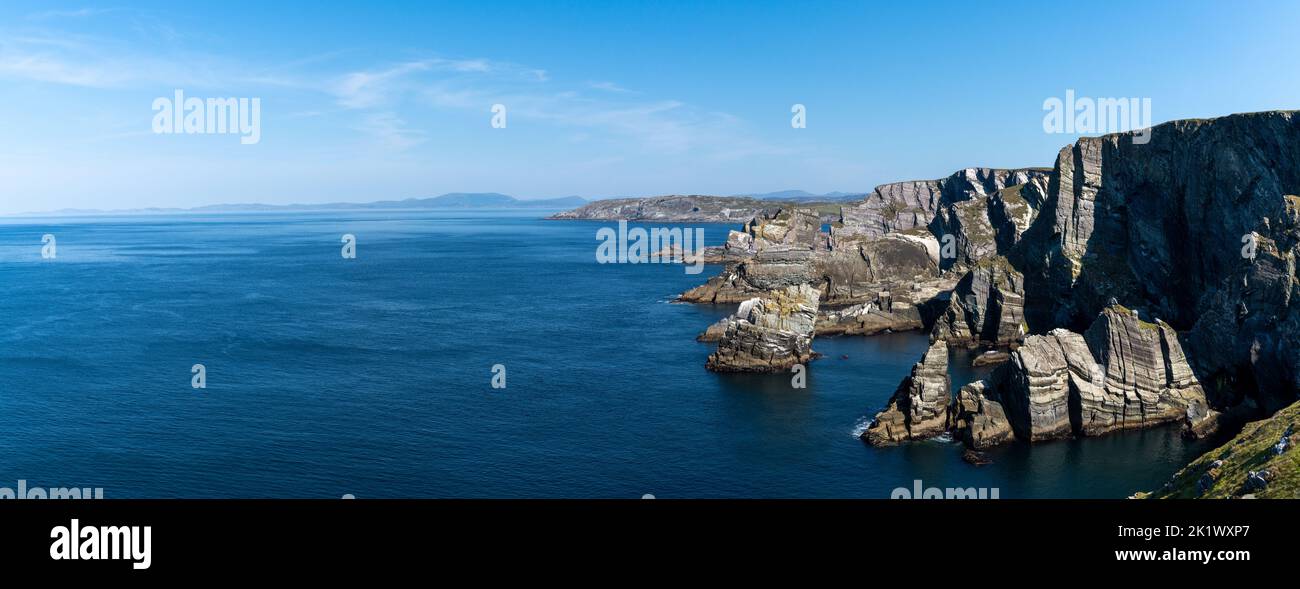 panorama landscape view of the cliffs and coast of the Mizen Peninsula in western Ireland Stock Photo