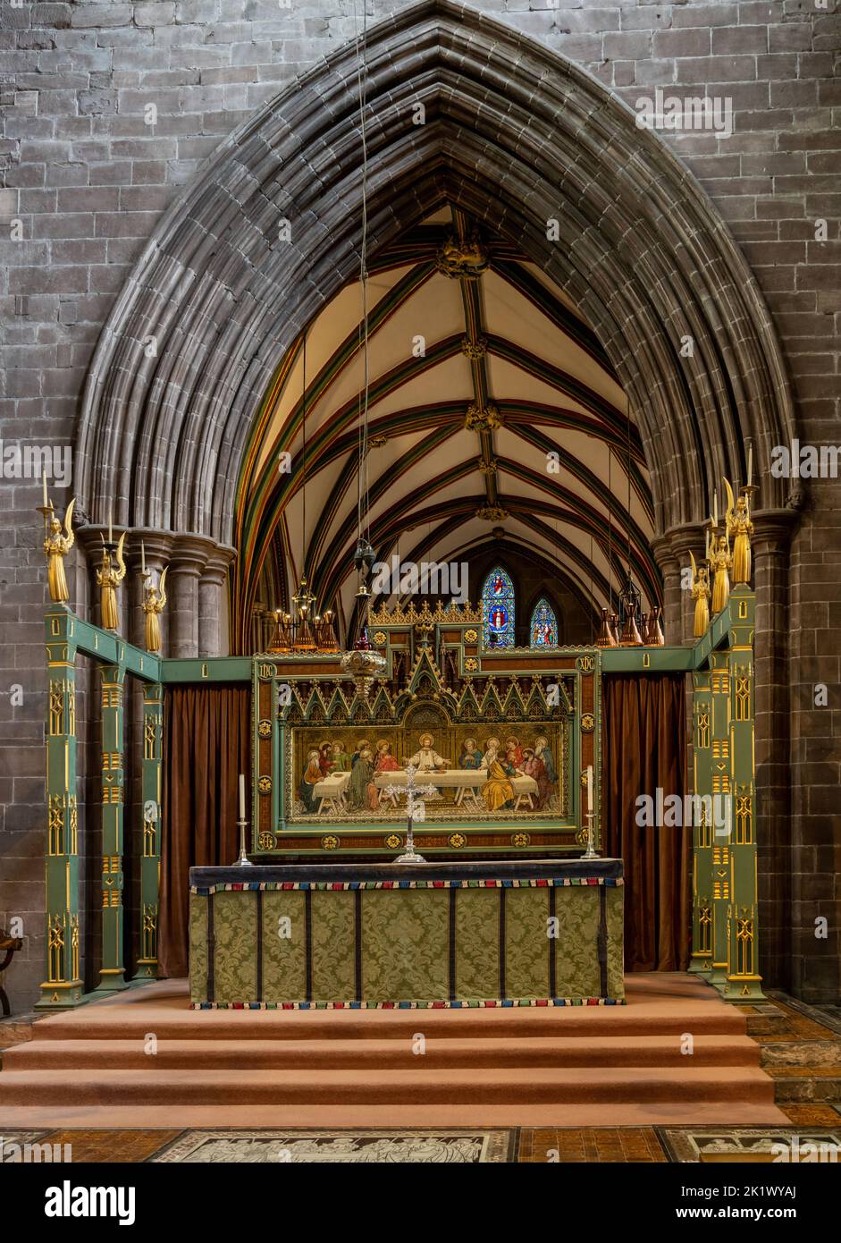Chester, United Kingdom - 26 August, 2022: ornate gilded altar with the Last Supper painting inside the historic Chester Cathedral in Cheshire Stock Photo