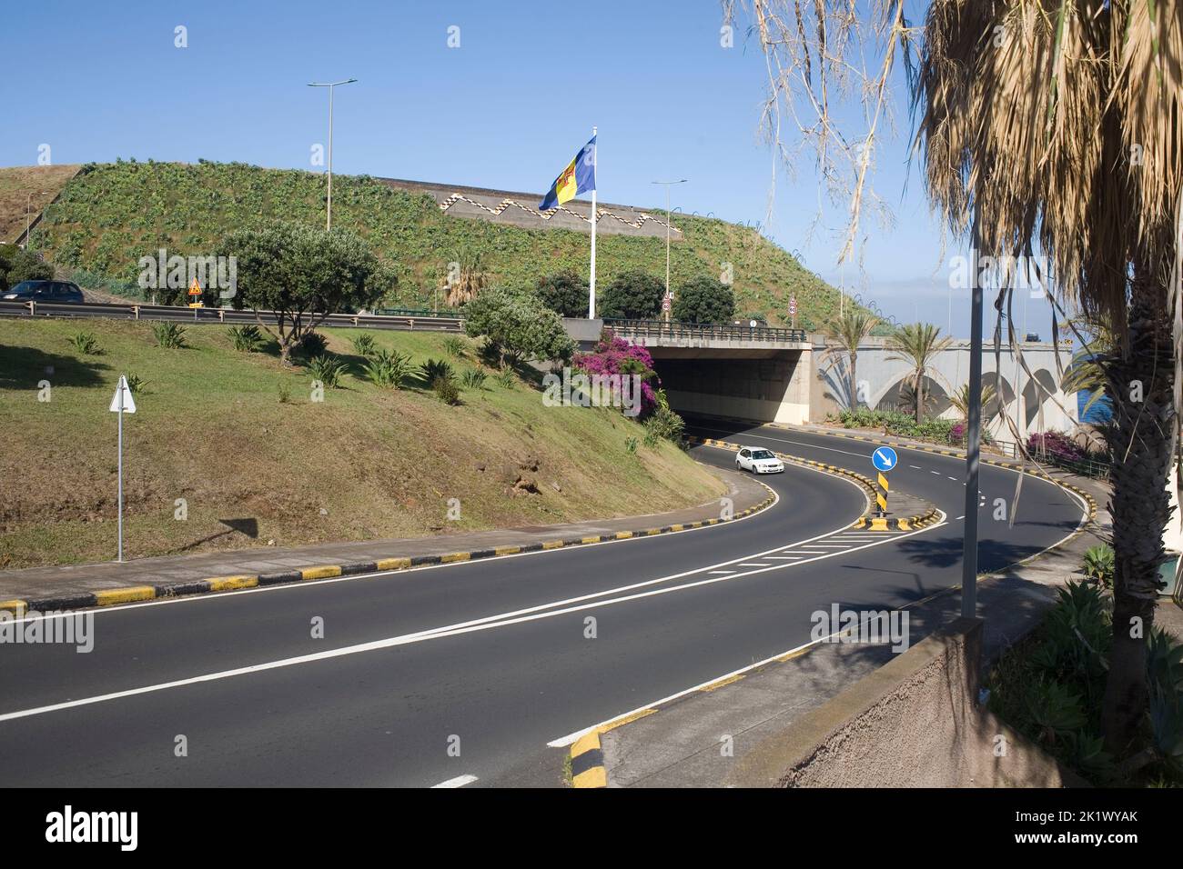 The ER207 road goes under the VR1 expressway at the end of the runway of Madeira's airport Stock Photo