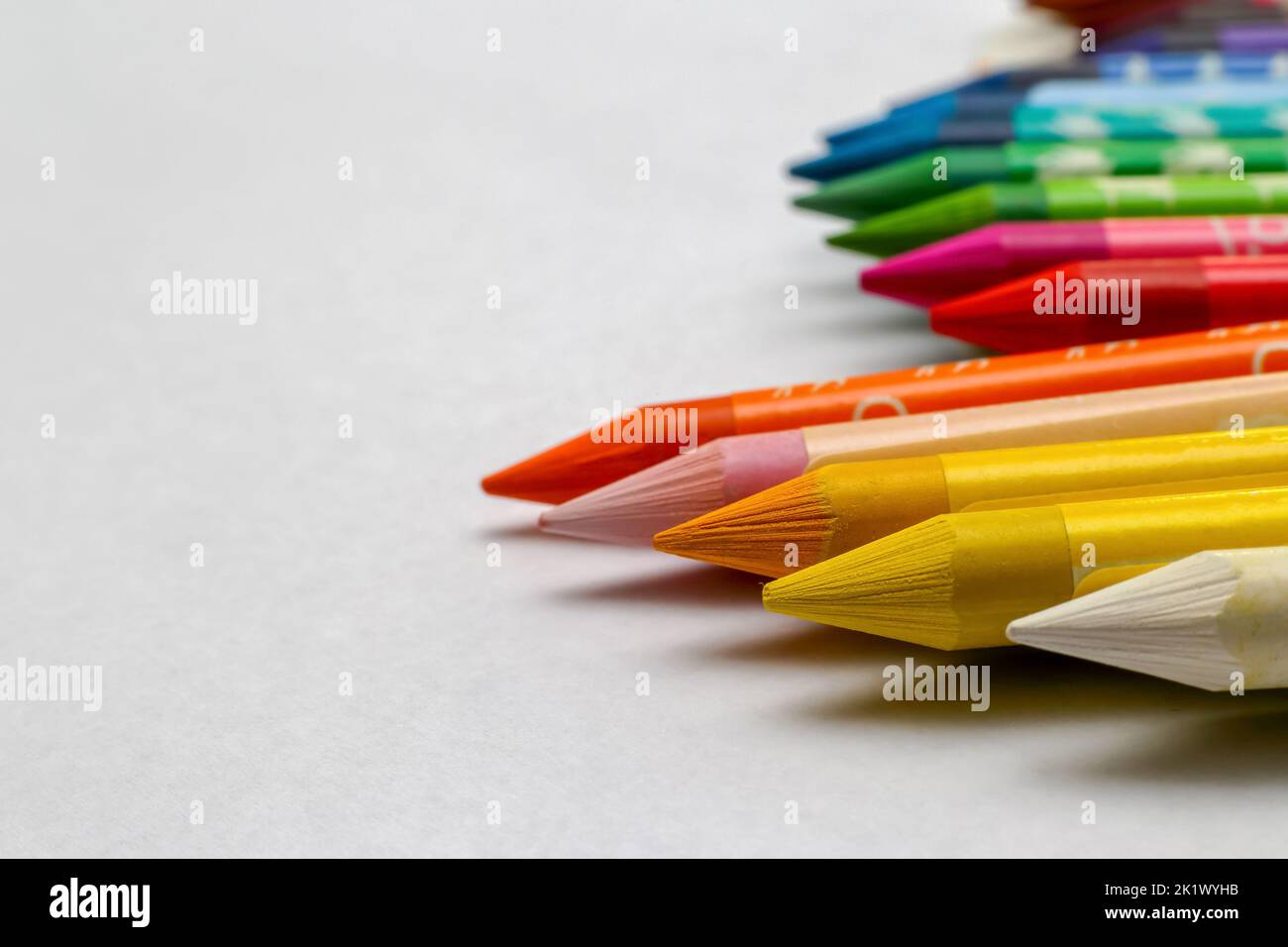 Colored wax crayons isolated on a white background Stock Photo