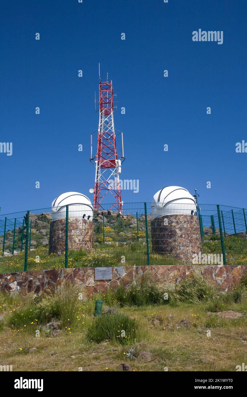 red and white telecommuincations mast at summit of Pico do Areiro in central Madeira Stock Photo
