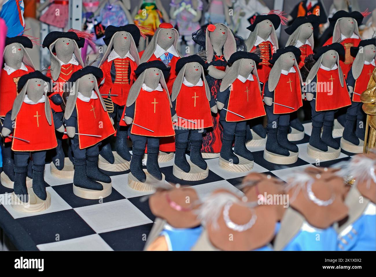 Collectible set of chessmen,  musketeers and cardinal guardsmen, is on display at the Fashion Doll International exhibit in Kiev, Ukraine Stock Photo