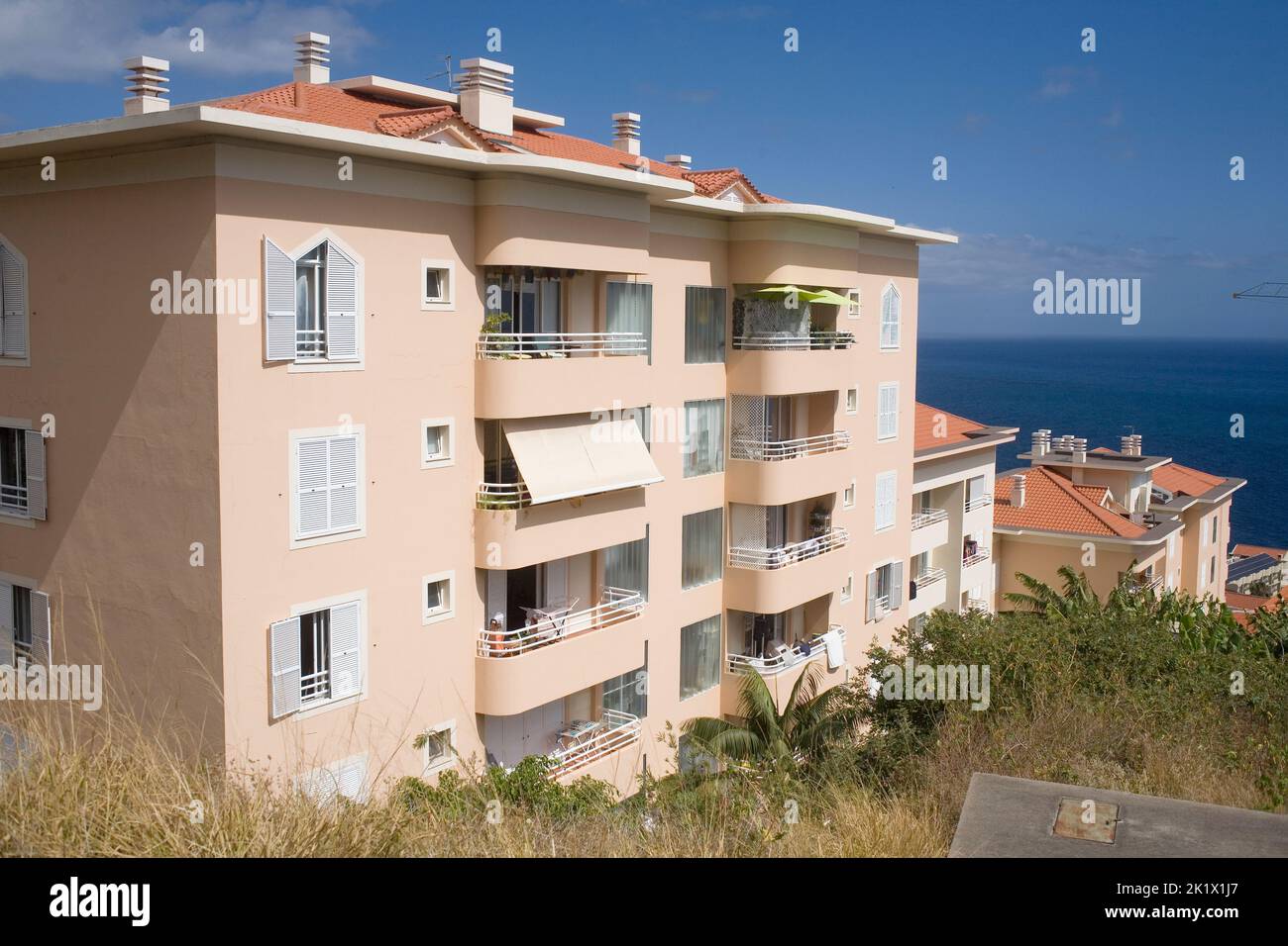 peach coloured apartments in the Sao Martinho part of Funchal Madeira Stock Photo Alamy