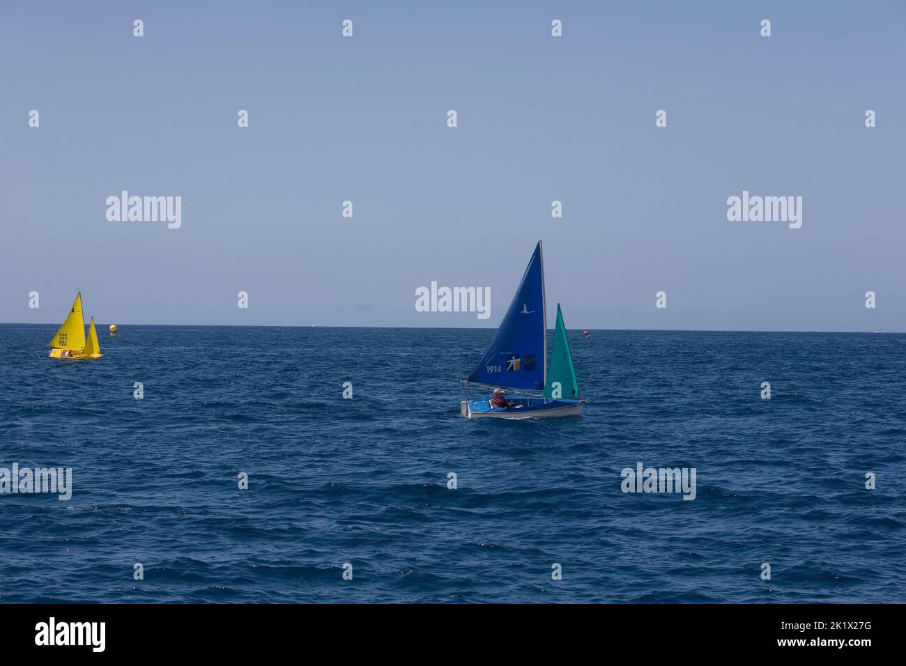 small sailing boats on the water just South of Funchal Madeira Stock Photo